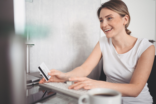 beautiful-happy-woman-holding-credit-card-hand-using-laptop-computer-keyboard-businesswoman-entrepreneur-working-online-shopping-e-commerce-internet-banking-spending-money-concept